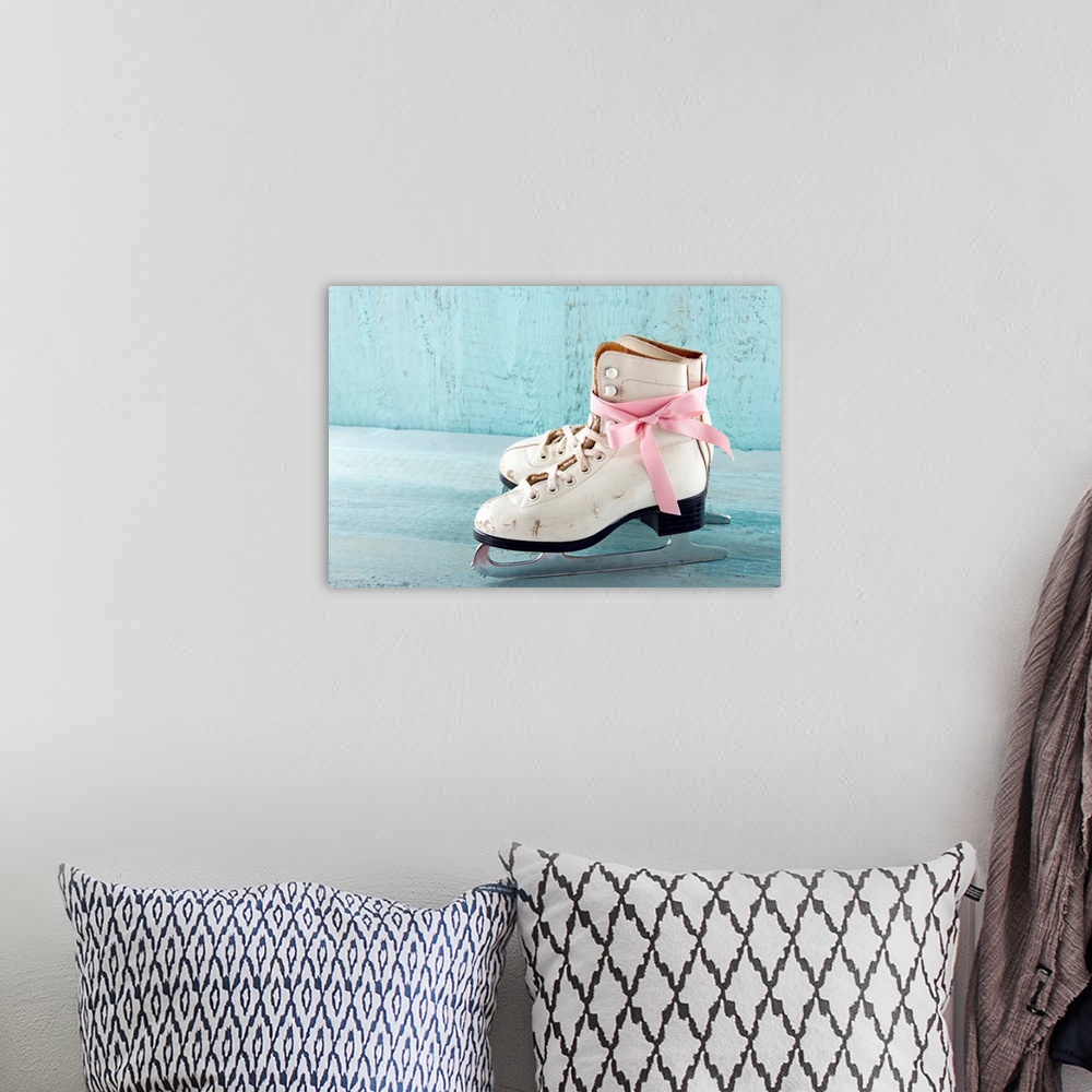 A bohemian room featuring Pair Of White Women's Ice Skates