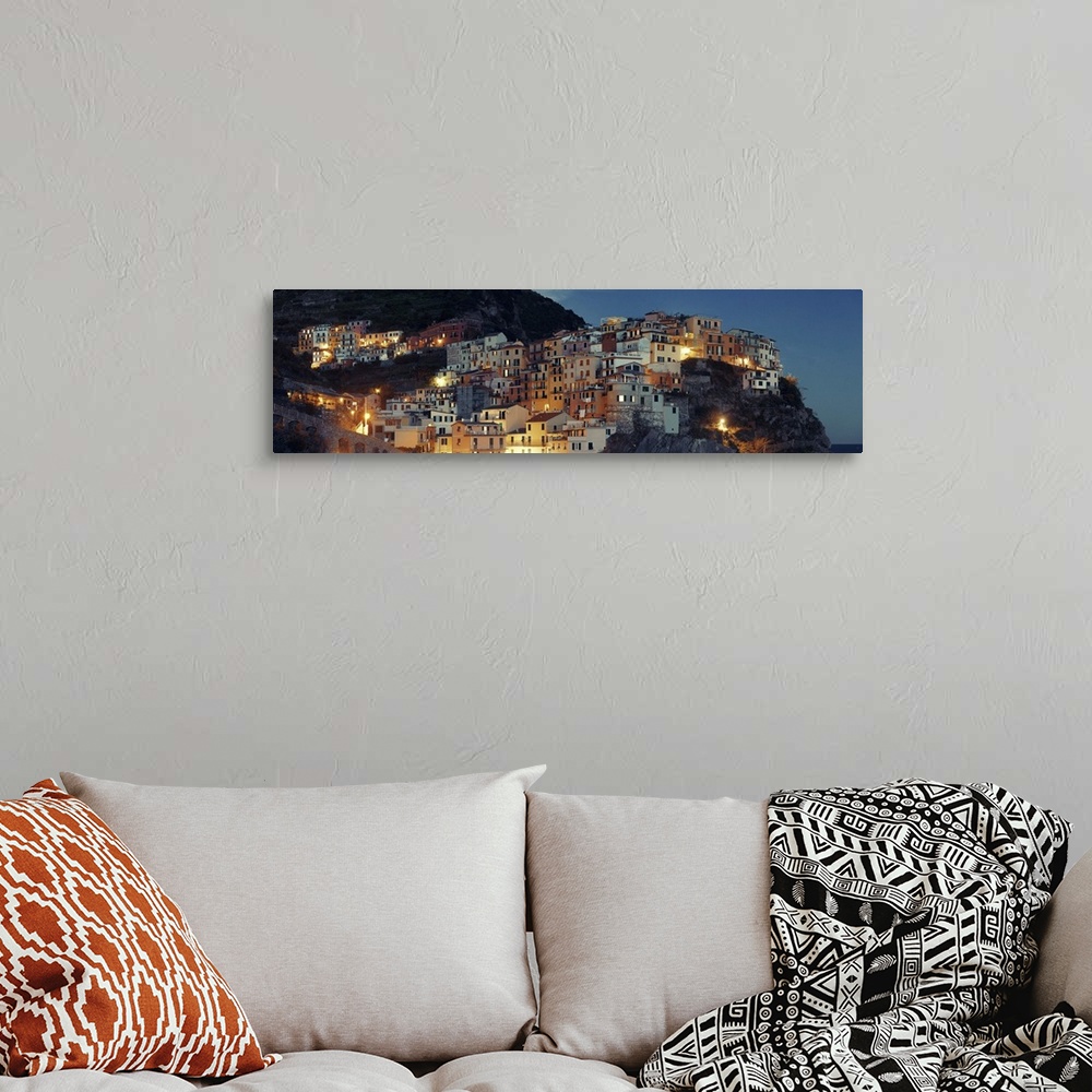 A bohemian room featuring Panoramic View Of Italian Buildings Over Cliff In Manarola, Cinque Terre, Italy