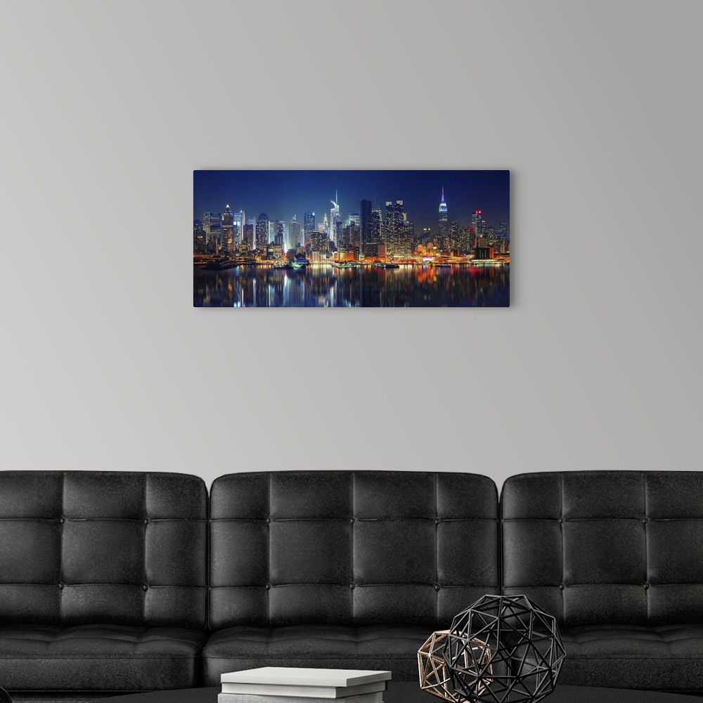 A modern room featuring Panoramic View Of Manhattan At Night