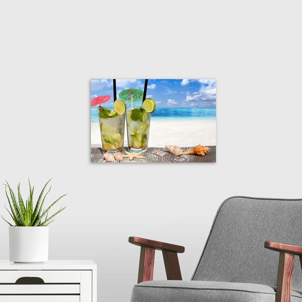 A modern room featuring Refreshing Cocktail on Wooden Boards with Starfish and Sea Shell on the Beach.