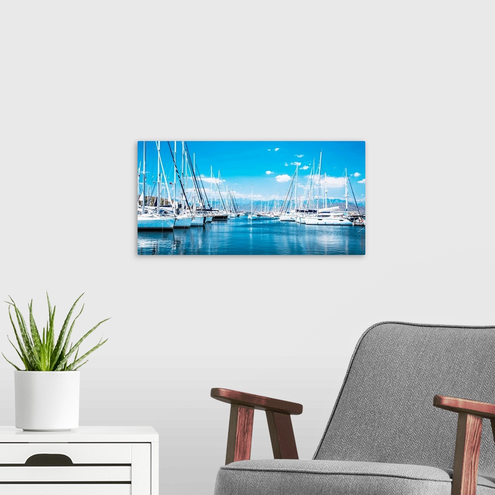 A modern room featuring Sailboat harbor, many beautiful moored sailing yachts in the sea port.