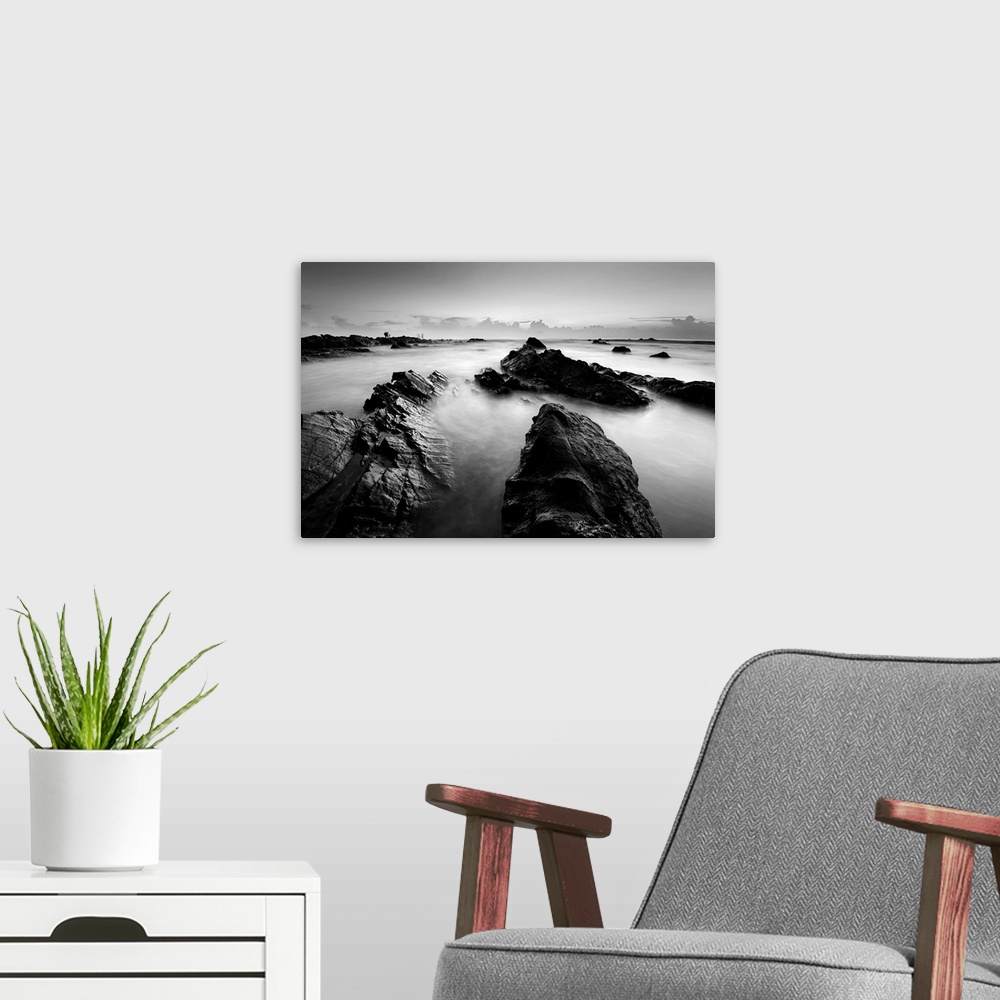 A modern room featuring Long exposure seascape in black and white.