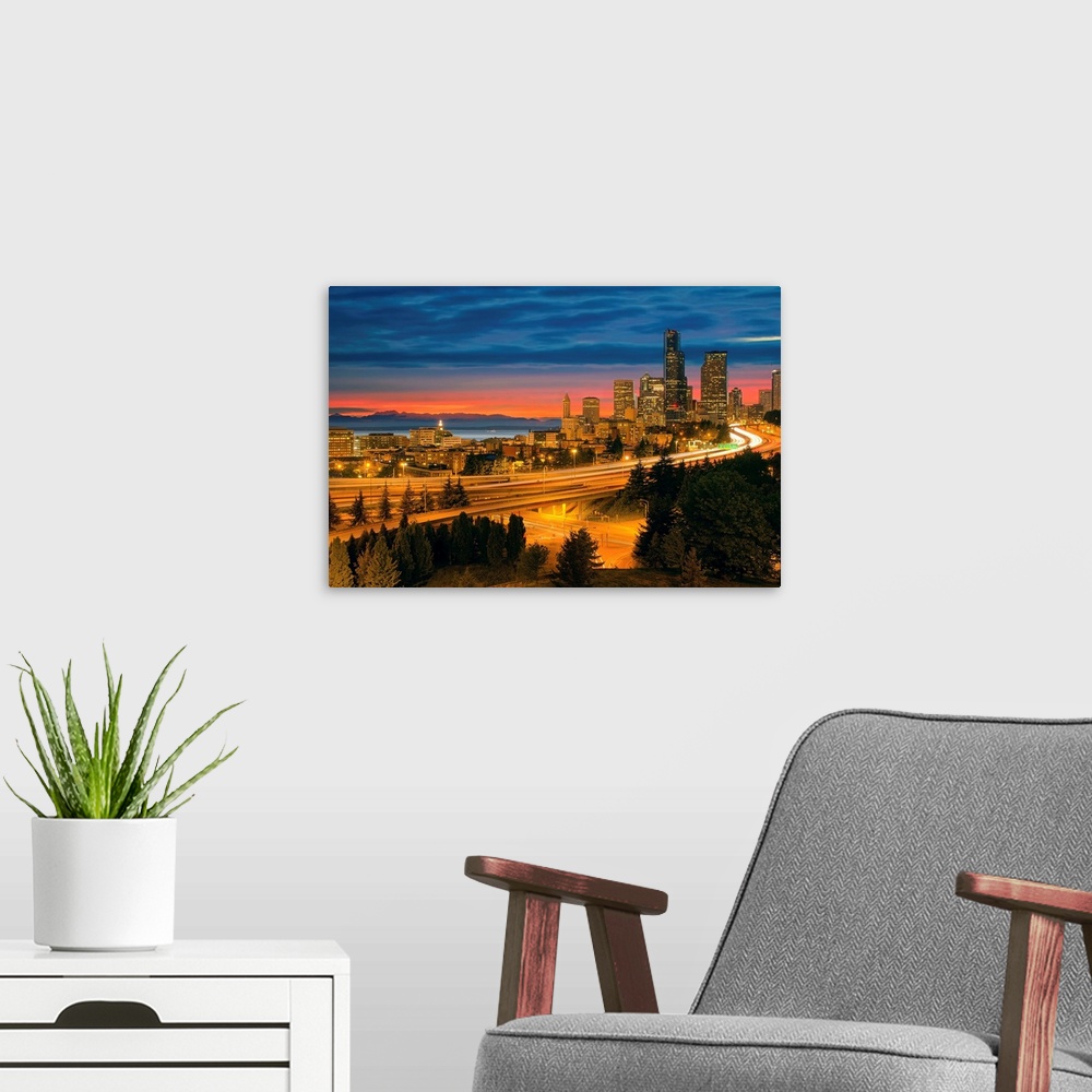 A modern room featuring Seattle Washington City Skyline with Freeway Light Trails After Sunset.