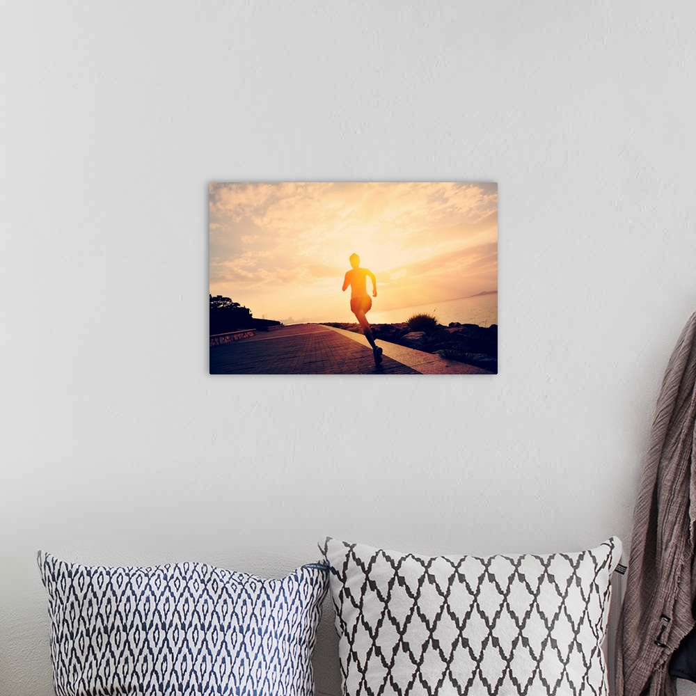 A bohemian room featuring Silhouette of a runner at seaside.