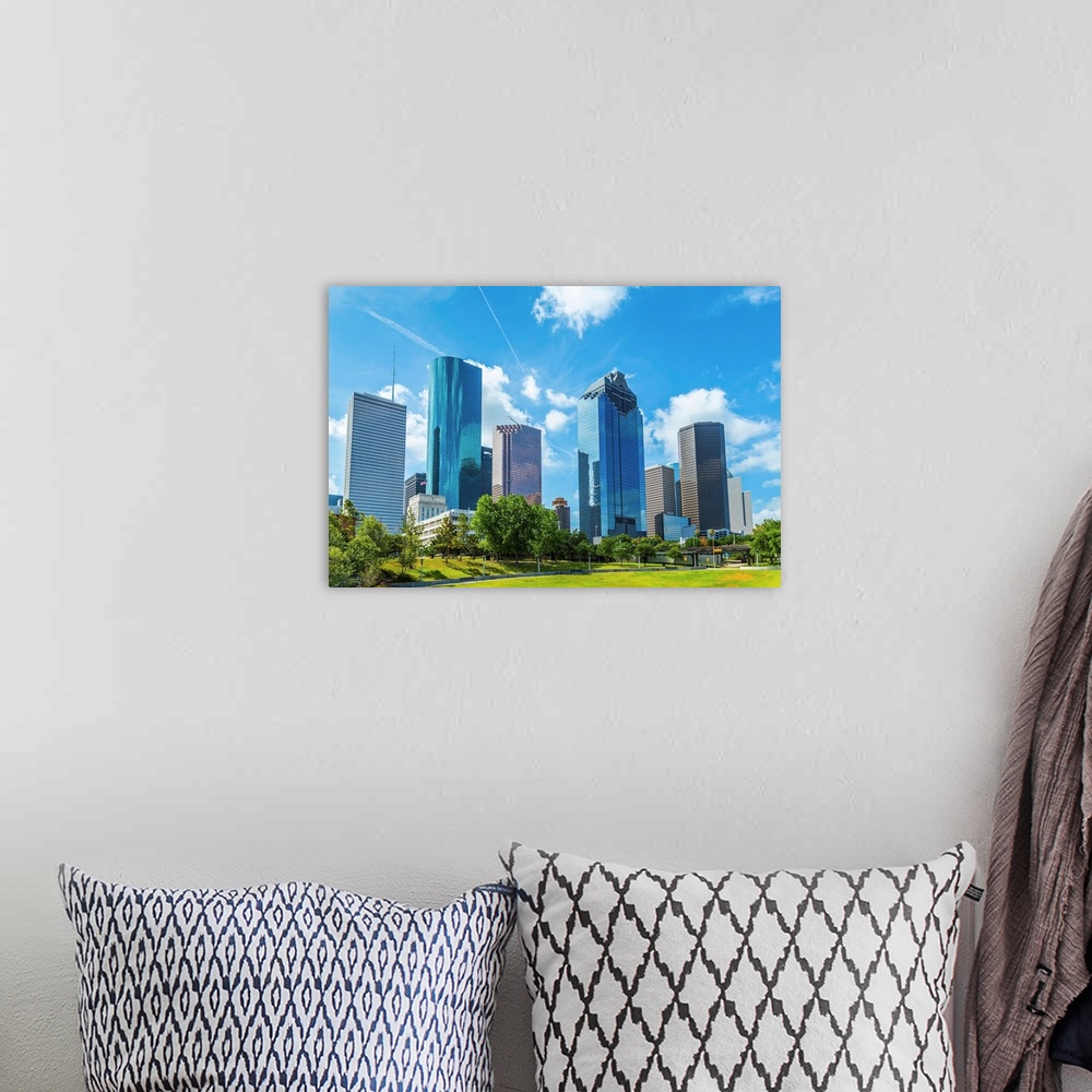 A bohemian room featuring Skyline of Houston Texas in daytime under blue sky.