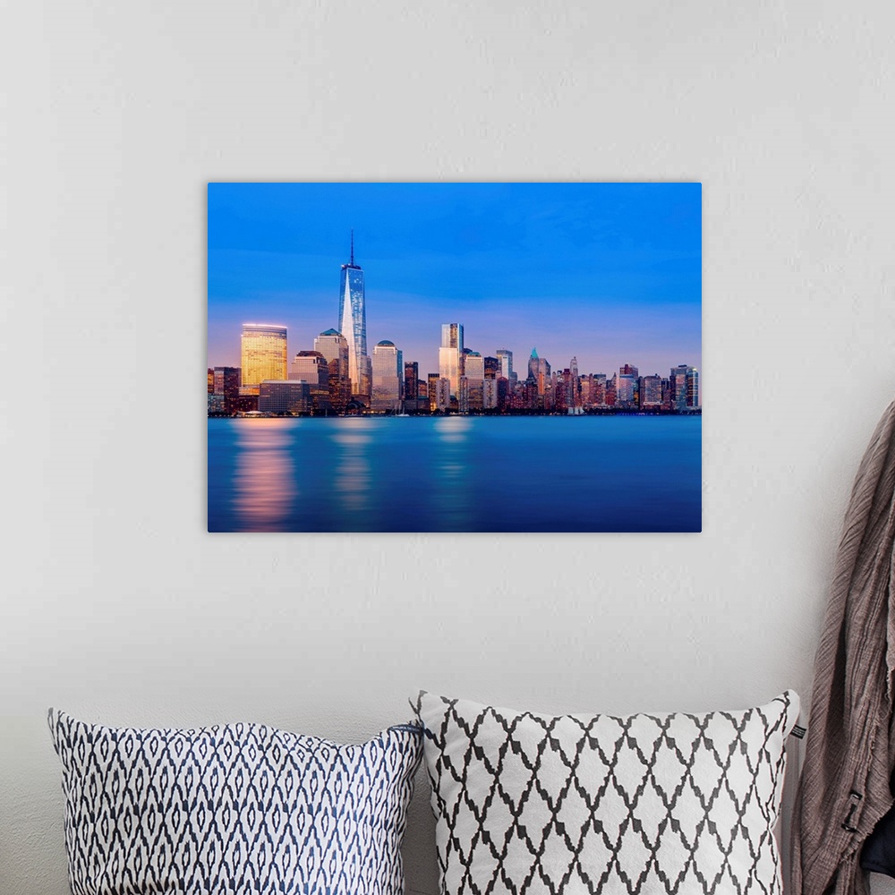 A bohemian room featuring Skyline of lower Manhattan of New York City at night with new One World Trade Center.