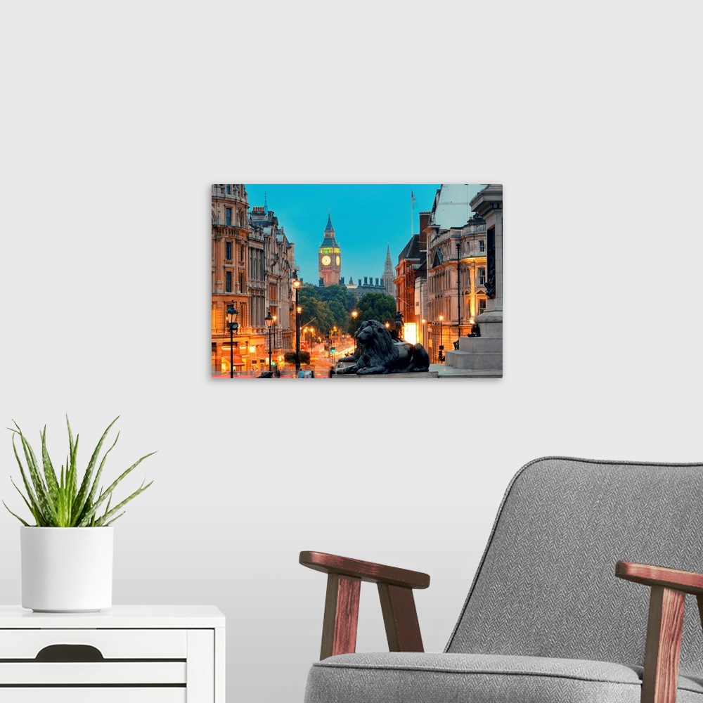 A modern room featuring Street view of Trafalgar Square at night in London