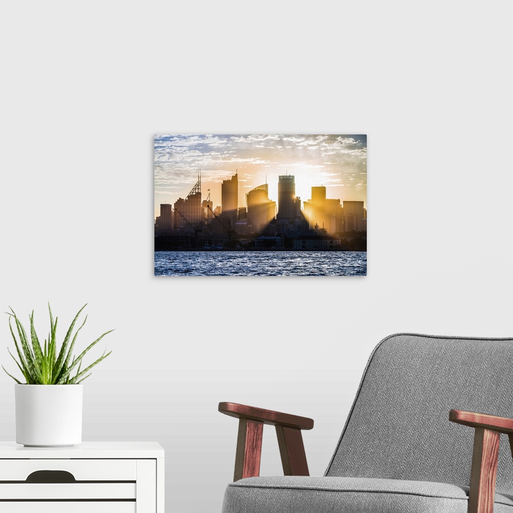 A modern room featuring Sun Rays Shining Through The Skyline Of Sydney