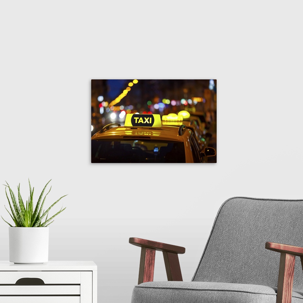 A modern room featuring Taxi And Blurred City Lights At Night