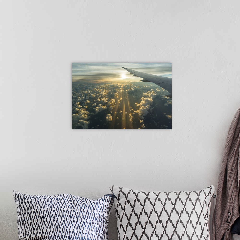 A bohemian room featuring View From Airplane Side Window Of Sunset Sky And Sunlit Clouds