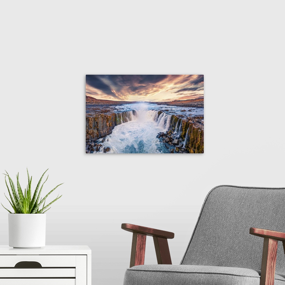 A modern room featuring View from flying drone of Selfoss Waterfall. Awesome summer sunrise on Jokulsa a Fjollum river, J...