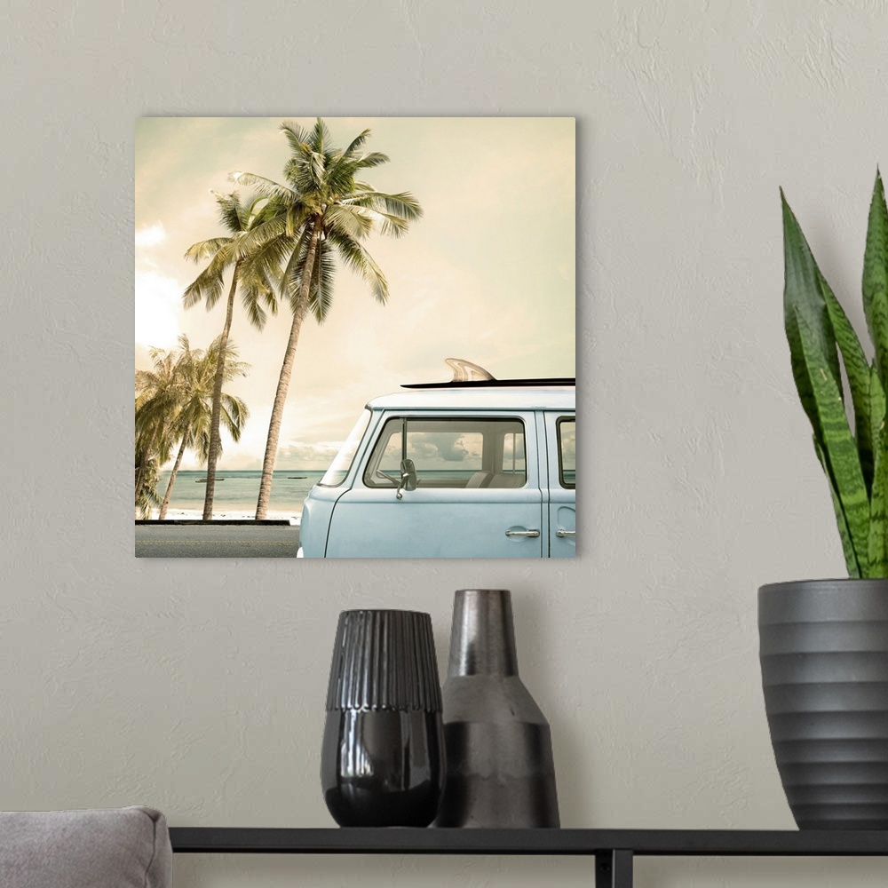 A modern room featuring Vintage car parked on a tropical beach with a surfboard on the roof.