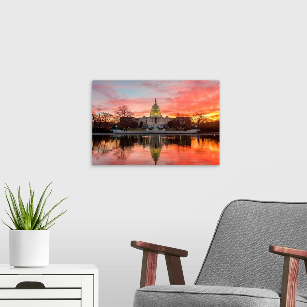 A modern room featuring Washington DC, Capitol Building in a cloudy sunrise with mirrored reflection.