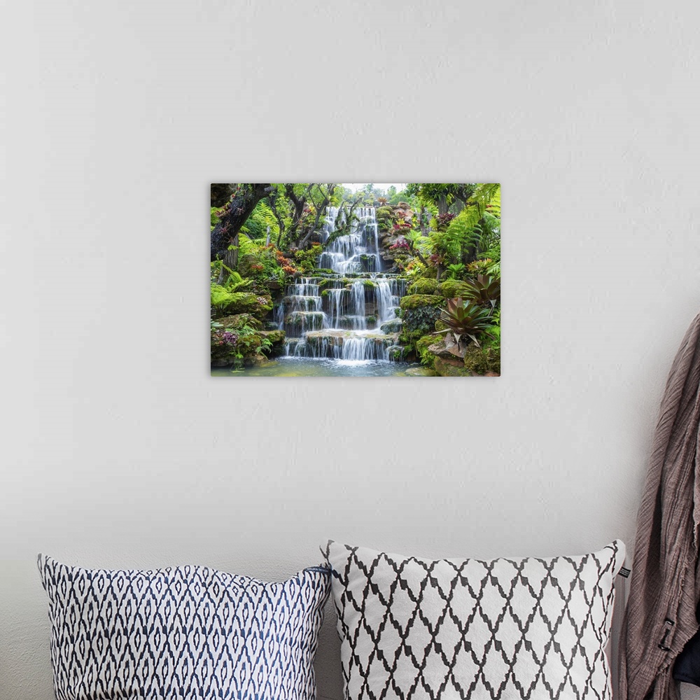 A bohemian room featuring Waterfall in Thailand. View of waterfall in beautiful garden at Sakon Nakhon Province, Thailand.