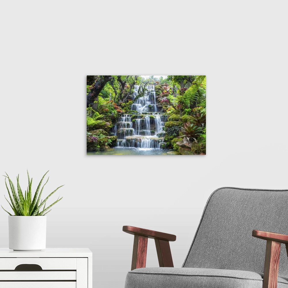 A modern room featuring Waterfall in Thailand. View of waterfall in beautiful garden at Sakon Nakhon Province, Thailand.