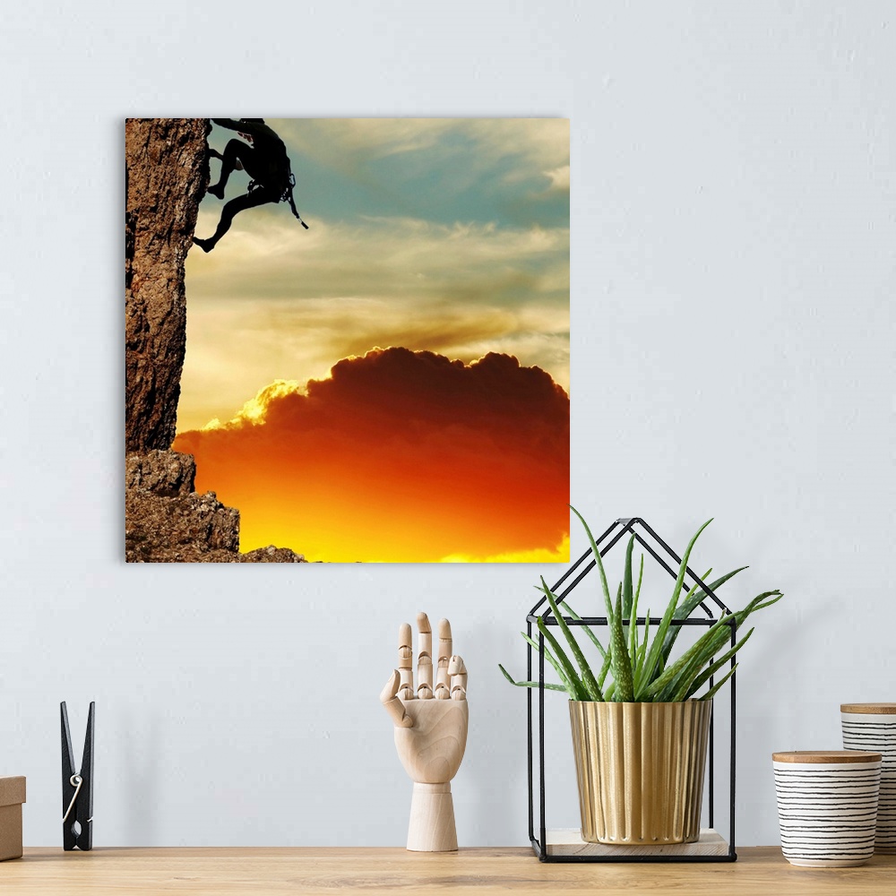 A bohemian room featuring girl climbing on the rock on sunset background