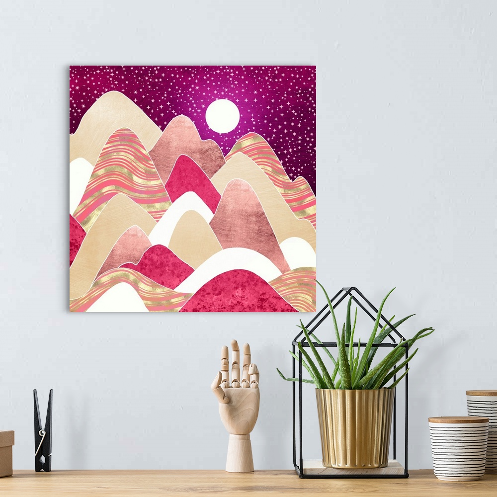 A bohemian room featuring Abstract depiction of hills with pink, gold, magenta, stars and moon.