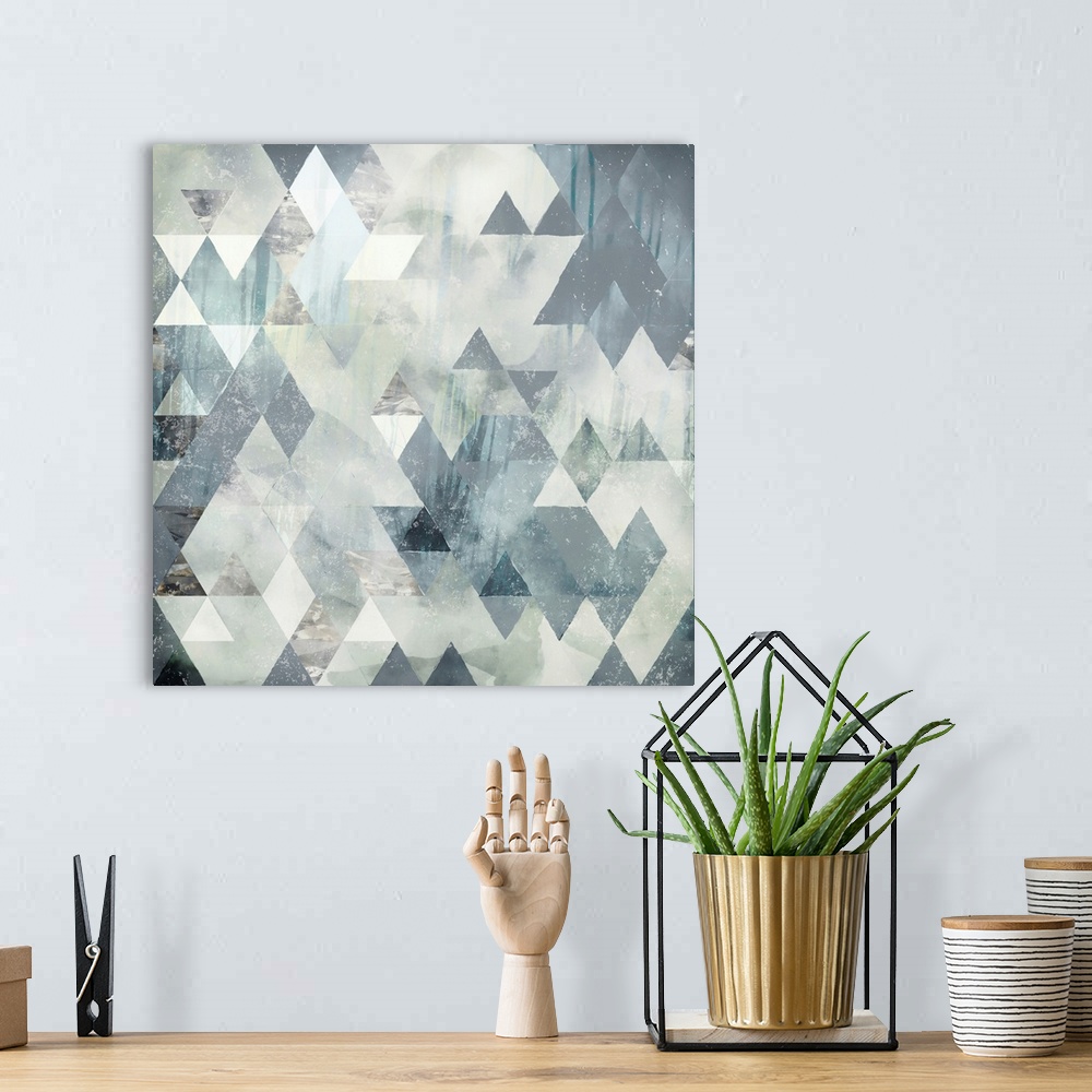 A bohemian room featuring Abstract geometric design with triangles, grey, ivory and blue.