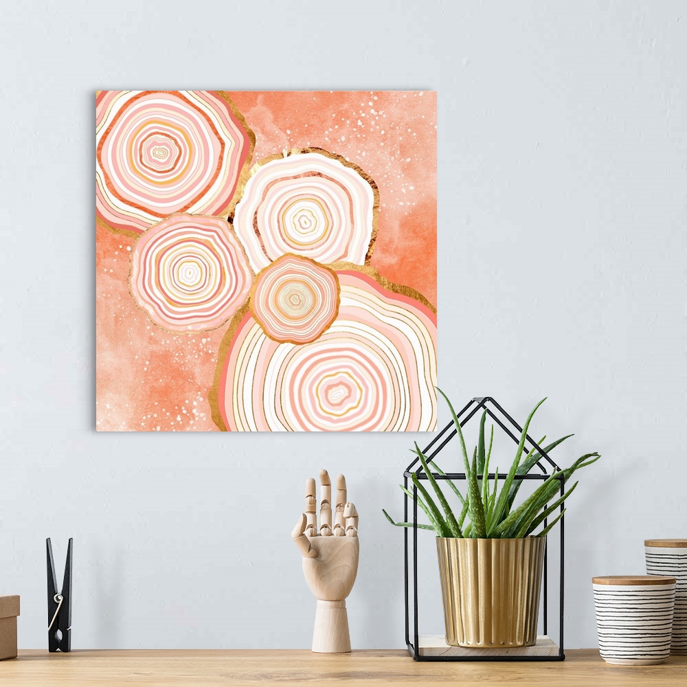 A bohemian room featuring Abstract depiction of agate slices with coral, gold, pink and white.