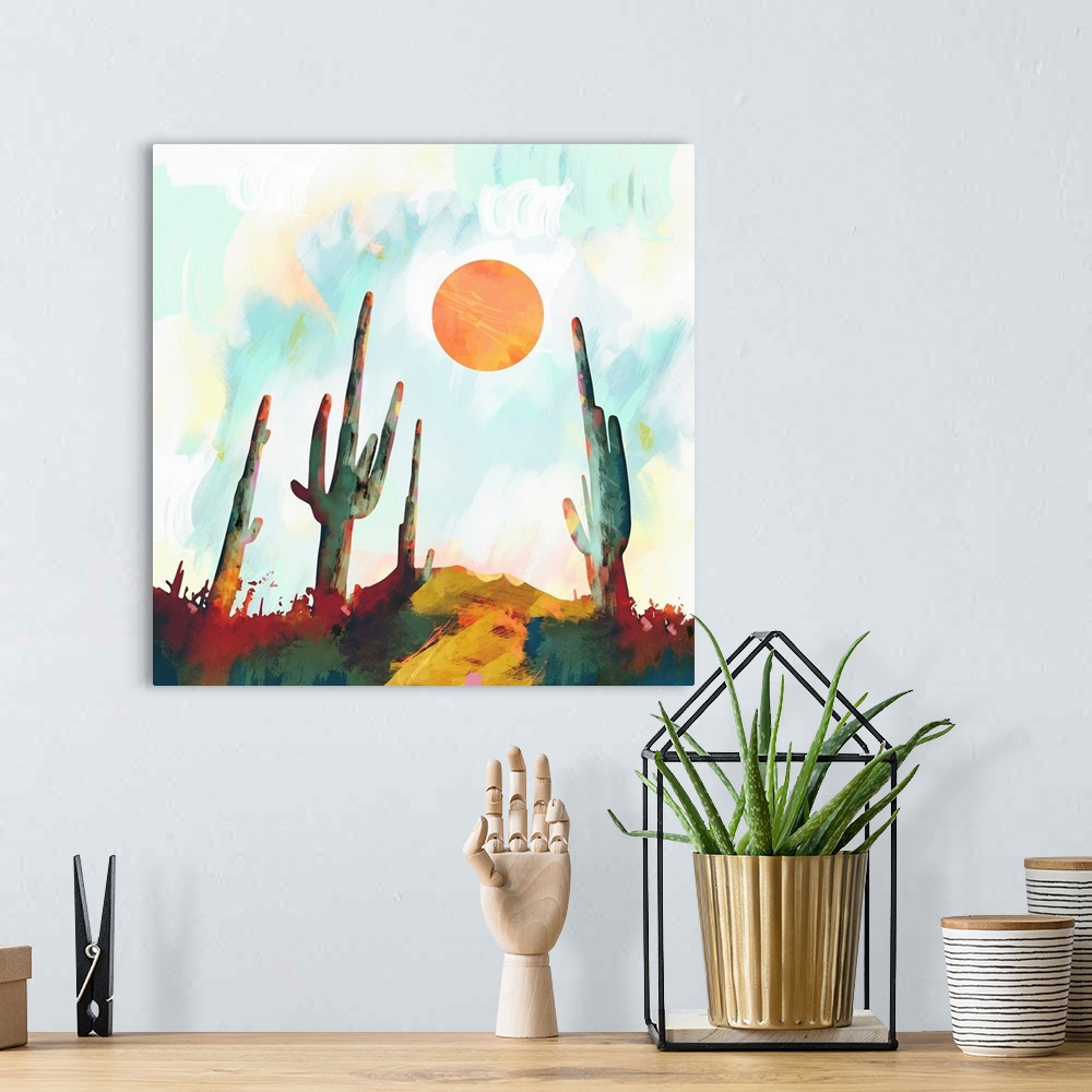A bohemian room featuring Abstract depiction of a desert landscape with cactus, sun, blue and orange.