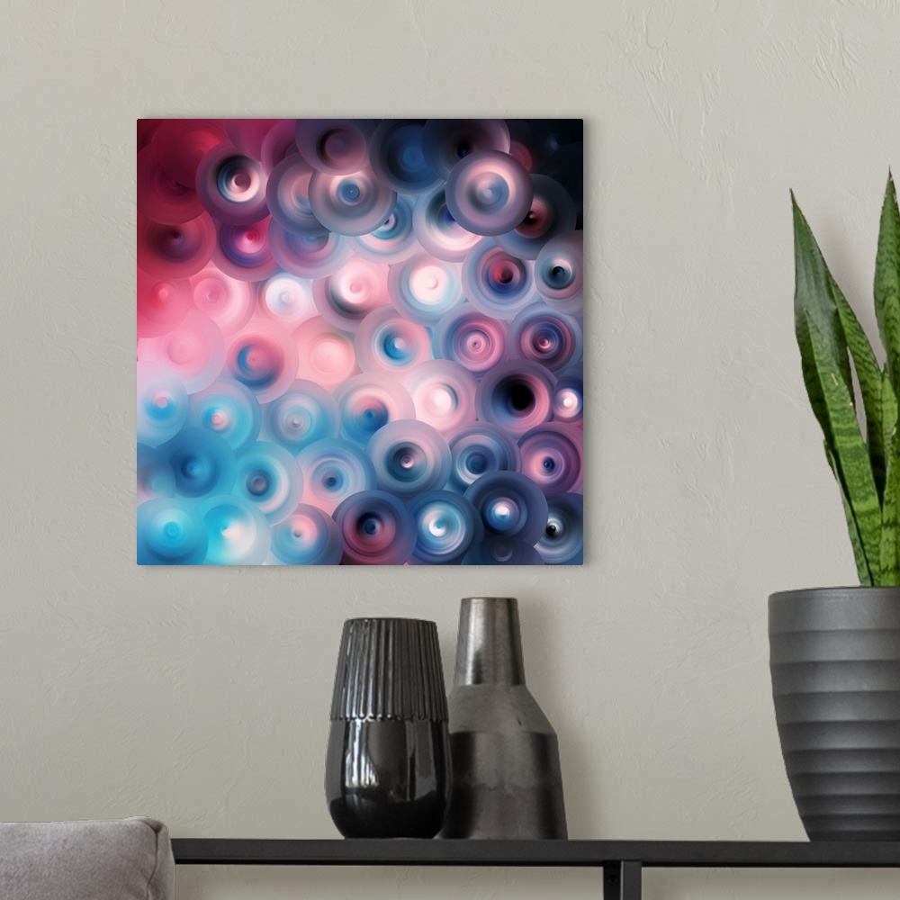 A modern room featuring Abstract artwork of overlapping swirling circles in bright shades of blue and pink mixed with dar...