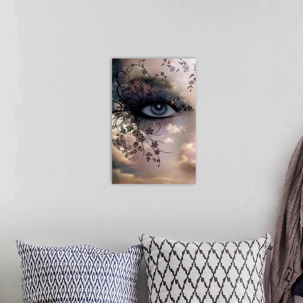 A bohemian room featuring Portrait large artwork of an eye with thick, heavy lashes that extend into swirling branches of t...