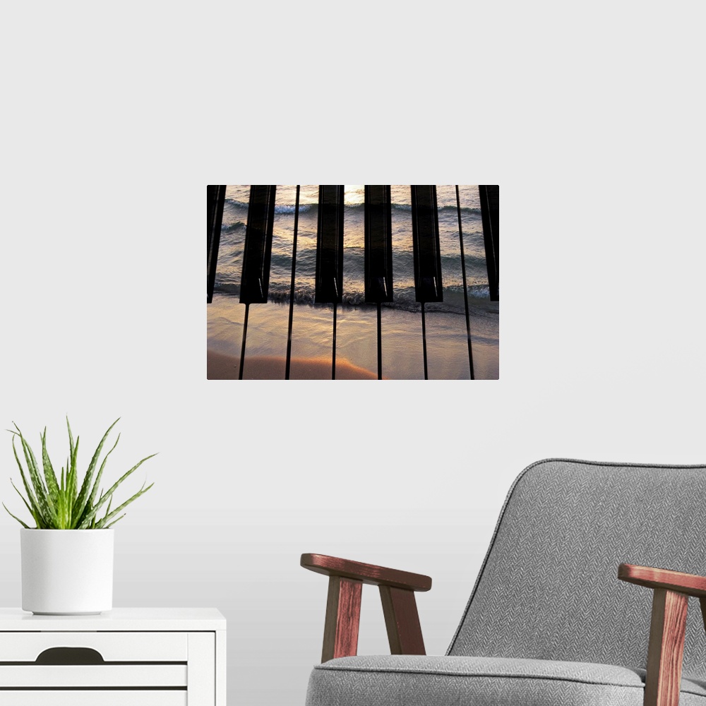 A modern room featuring Big photograph focuses on the keys of a piano that have another picture of a sea crashing into a ...