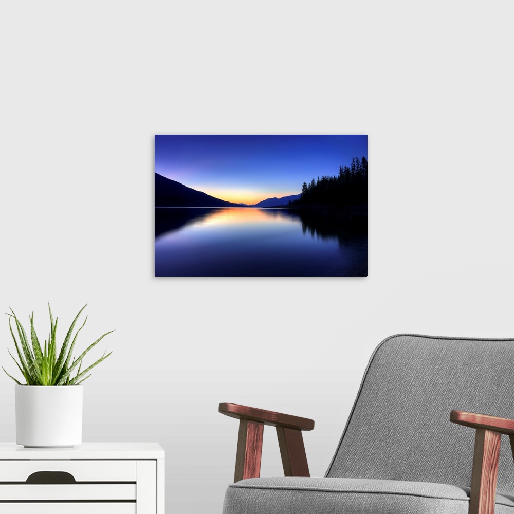 A modern room featuring A beautiful blue and orange sunset on a mountain lake in British Columbia, Canada.
