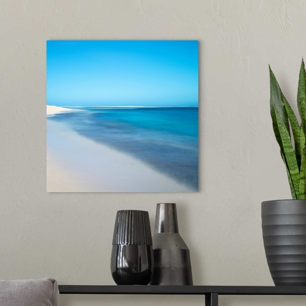 A modern room featuring A blue ocean abstract of a beach in Hawaii.
