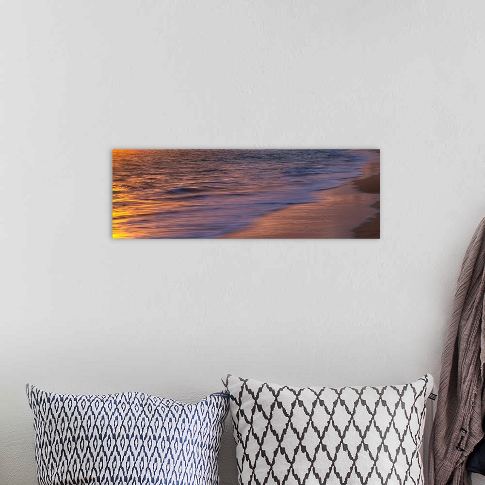 A bohemian room featuring A abstract image of sunrise reflecting of a Pacific Ocean beach in Hawaii.