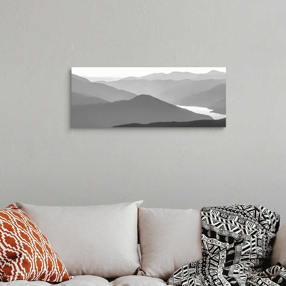 A bohemian room featuring Black and white image of many layers of mountain range in the Monashee Mountains, Canada.