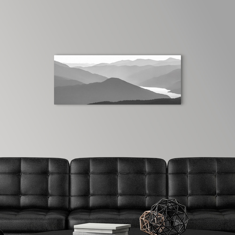 A modern room featuring Black and white image of many layers of mountain range in the Monashee Mountains, Canada.