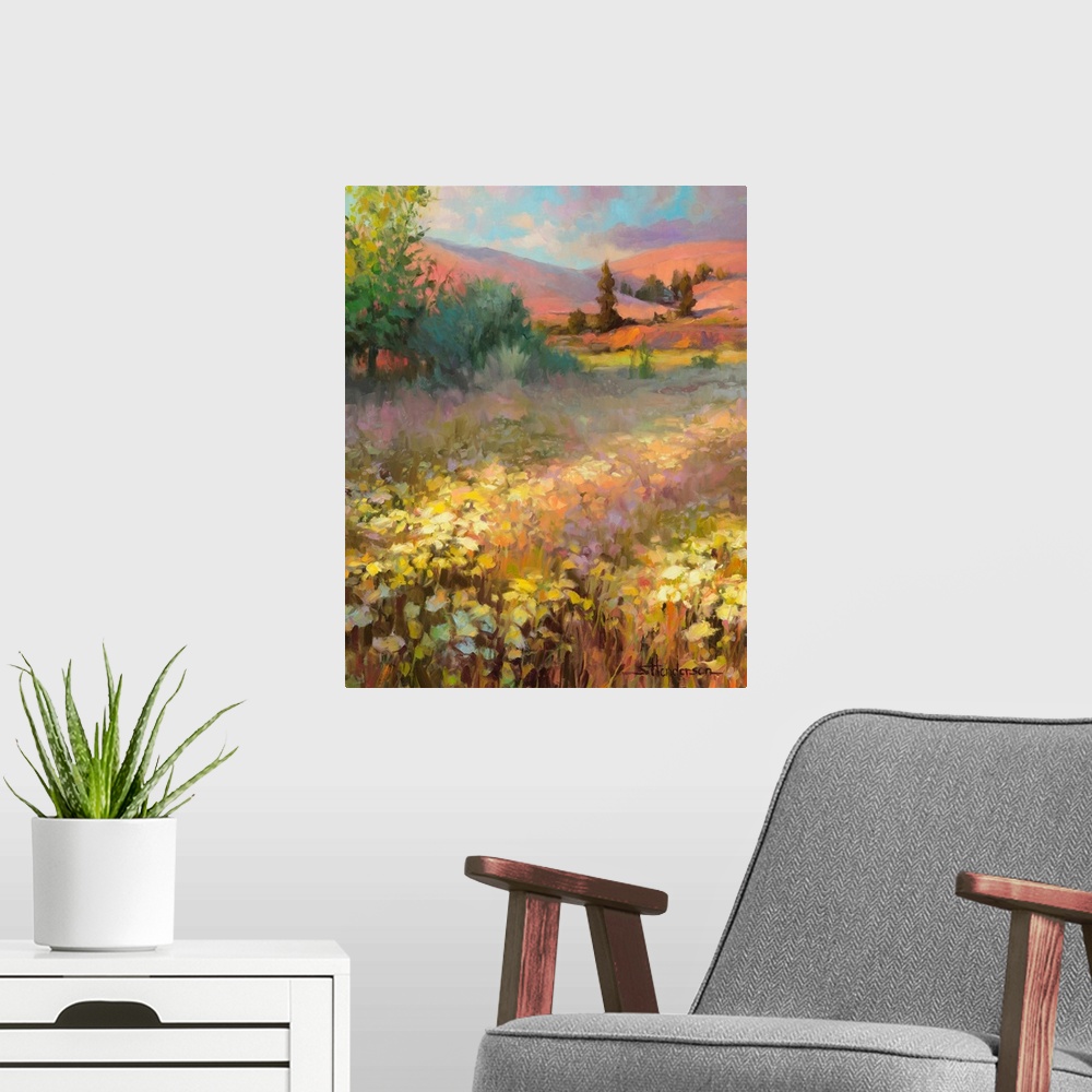 A modern room featuring Traditional impressionist landscape of a springtime field of wildflowers, with the hills in the b...