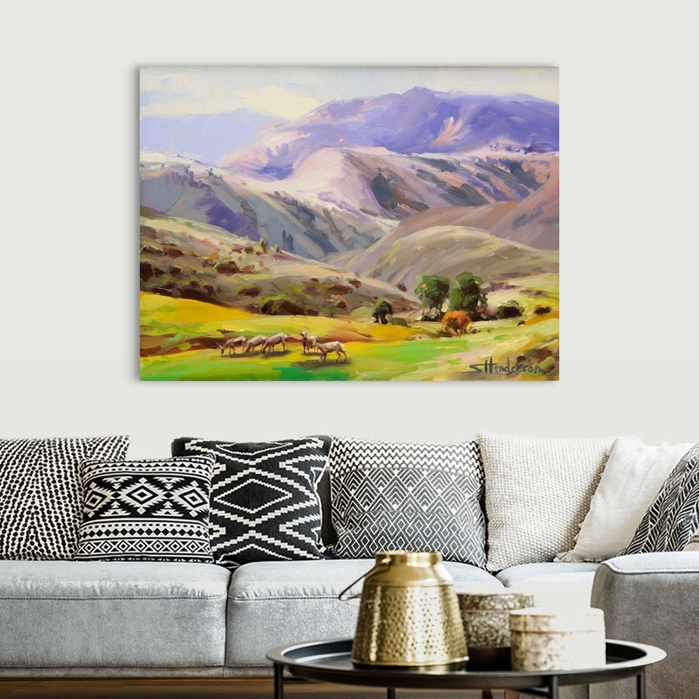 A bohemian room featuring Traditional impressionist landscape painting of a herd of wild deer grazing on the grass in the I...