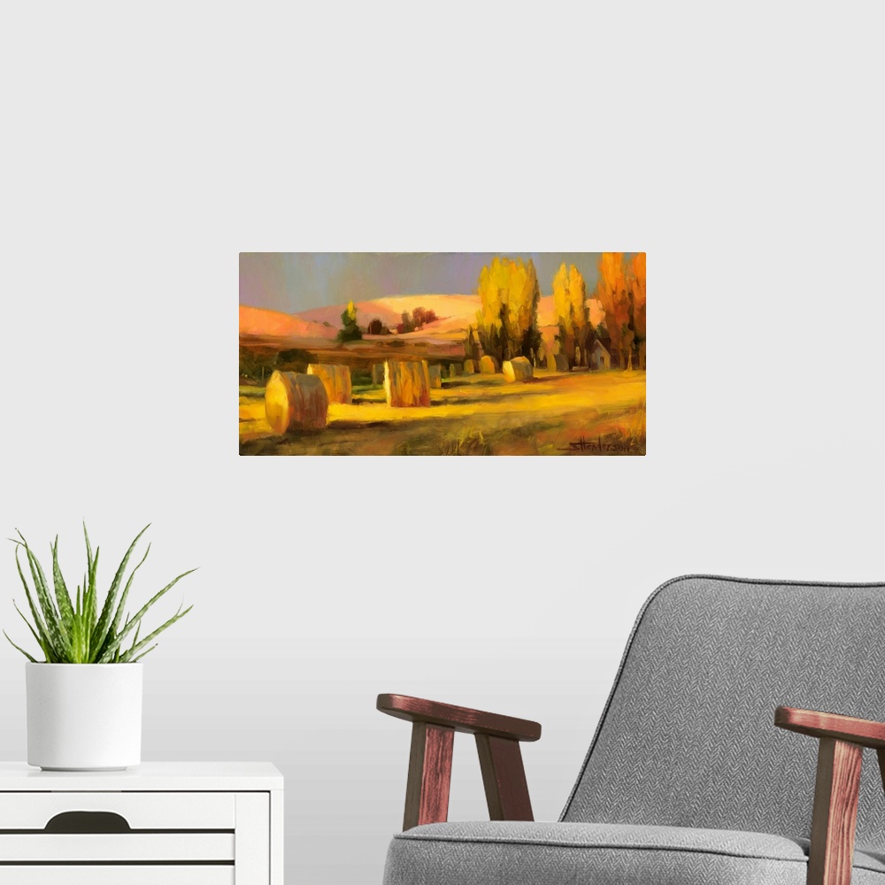 A modern room featuring Traditional impressionist landscape painting of a country farm and field in the late summer, with...