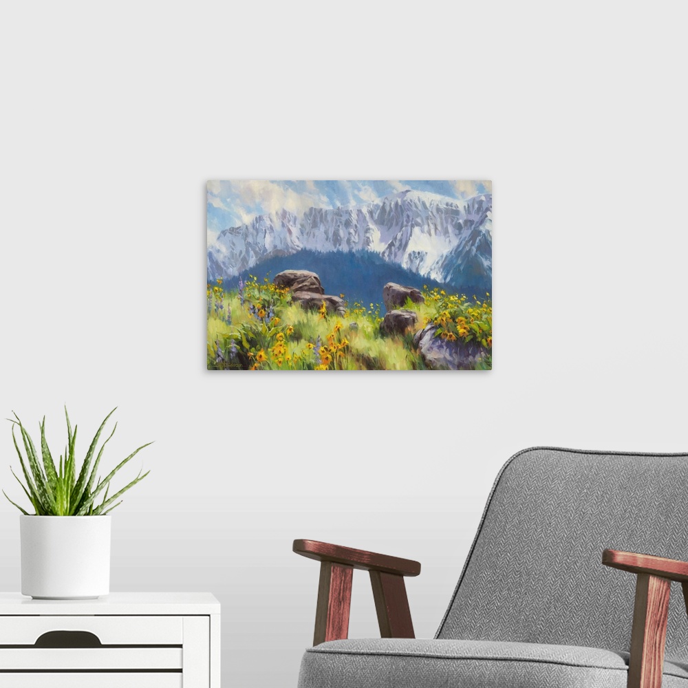 A modern room featuring Traditional representational landscape painting of snow-capped mountains and a sunlit meadow of w...
