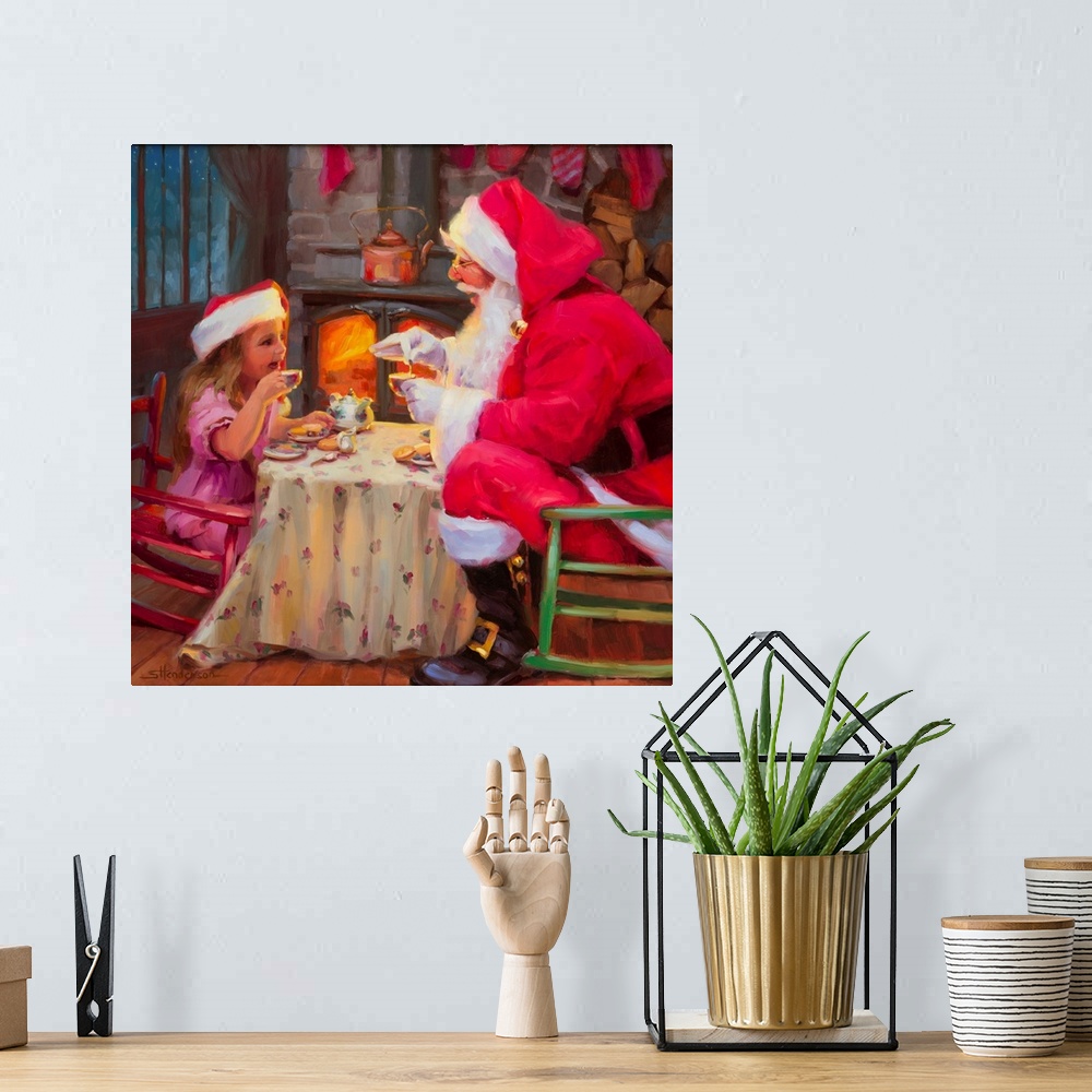 A bohemian room featuring Traditional representational holiday Christmas painting of Santa Claus, and the family cat and do...