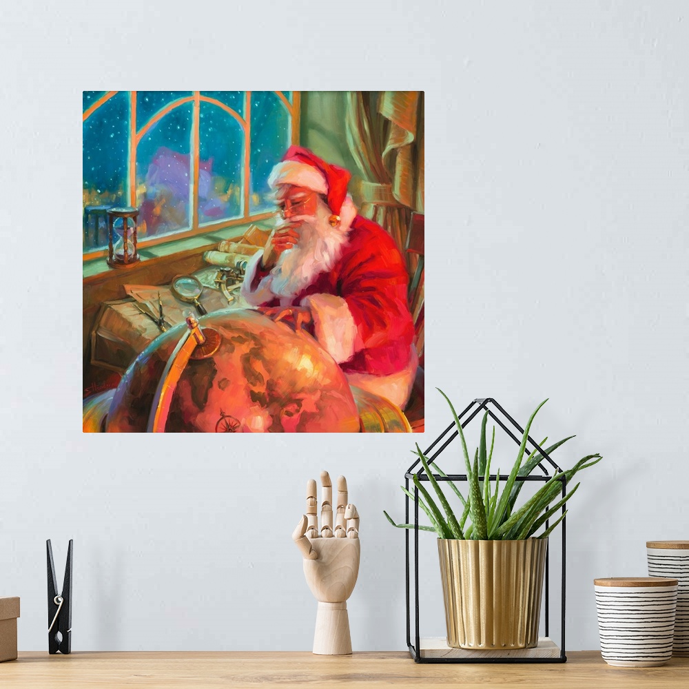 A bohemian room featuring Traditional representational holiday Christmas painting of Santa in his workshop, holding up a ma...