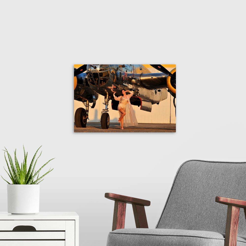 A modern room featuring Sexy 1940's pin-up girl in lingerie posing with a B-25 bomber.