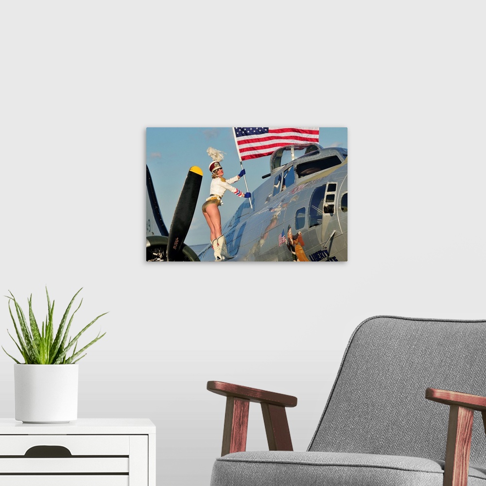 A modern room featuring Patriotic 1940's style majorette pin-up girl standing on a B-17 bomber with an American flag.