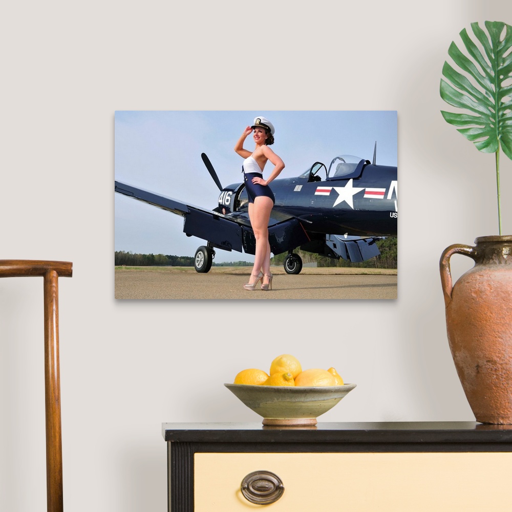 A traditional room featuring Beautiful 1940's style Navy pin-up girl posing with a vintage Corsair aircraft.