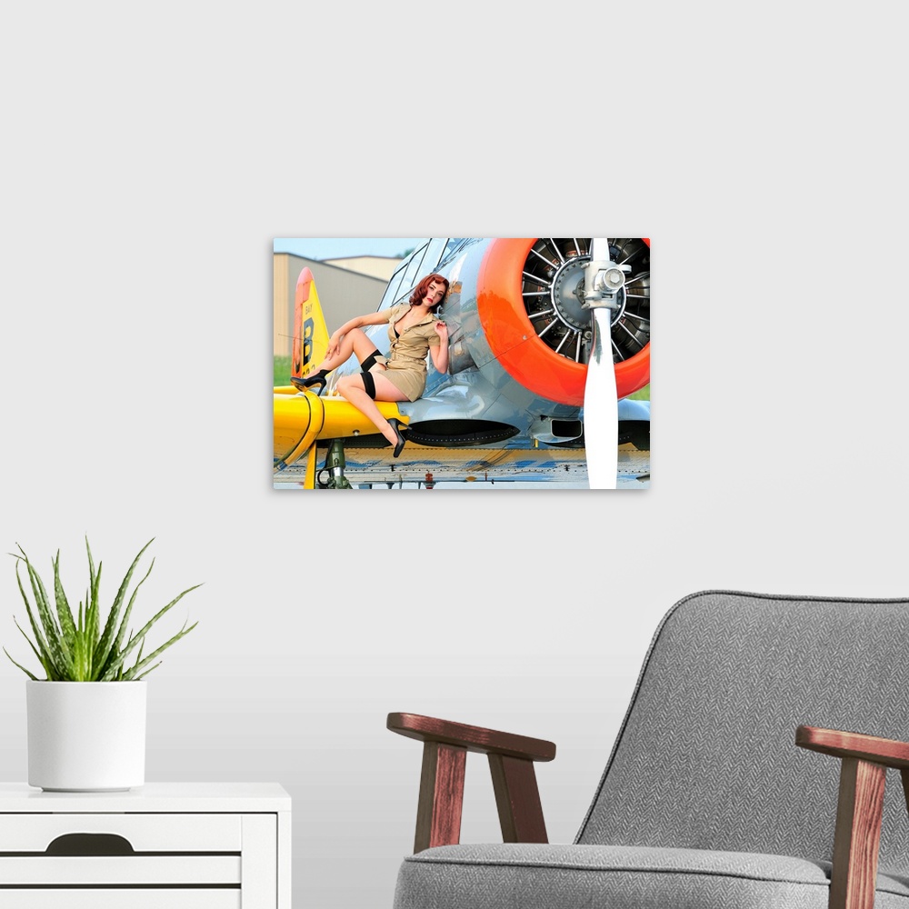 A modern room featuring 1940's style pin-up girl posing on a T-6 Texan training aircraft.