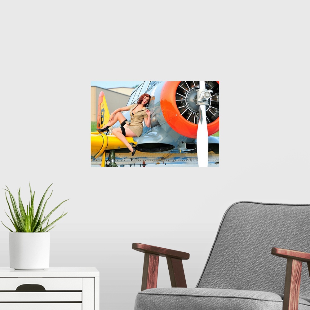 A modern room featuring 1940's style pin-up girl posing on a T-6 Texan training aircraft.