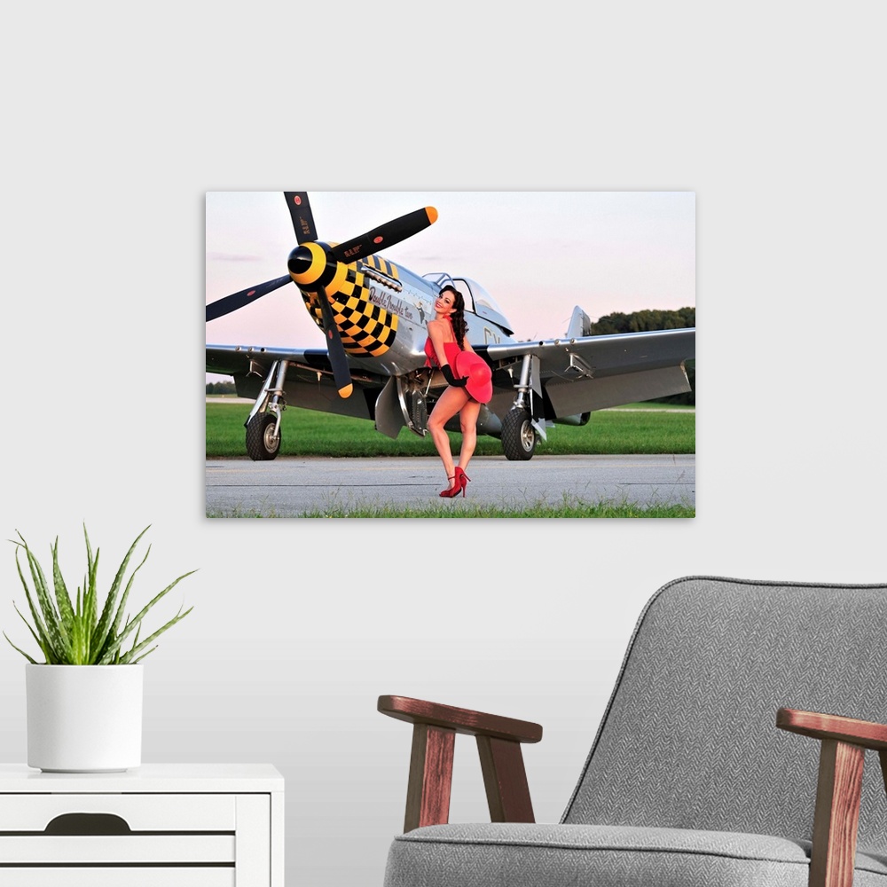 A modern room featuring Sexy 1940's style pin-up girl posing with a P-51 Mustang fighter plane.