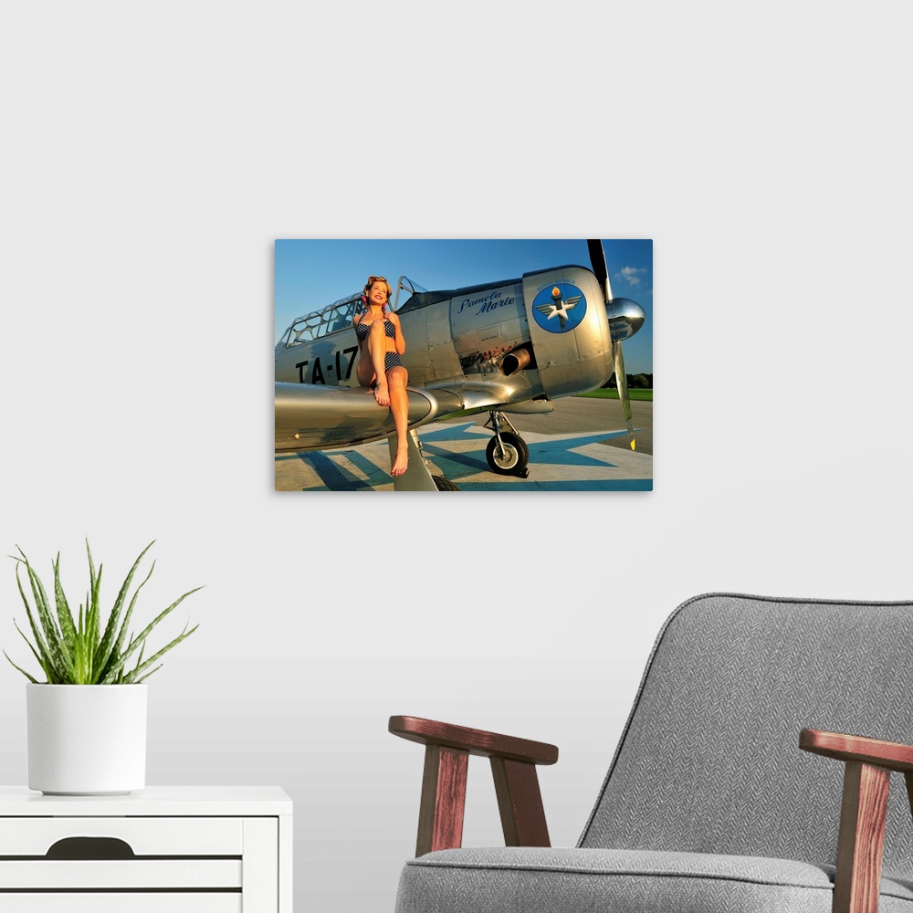 A modern room featuring 1940's style pin-up girl sitting on the wing of a World War II T-6 Texan.