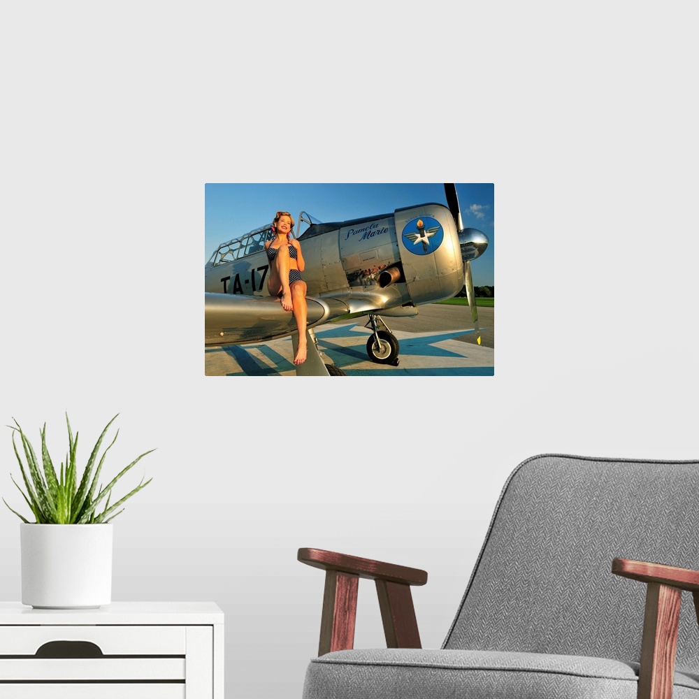 A modern room featuring 1940's style pin-up girl sitting on the wing of a World War II T-6 Texan.