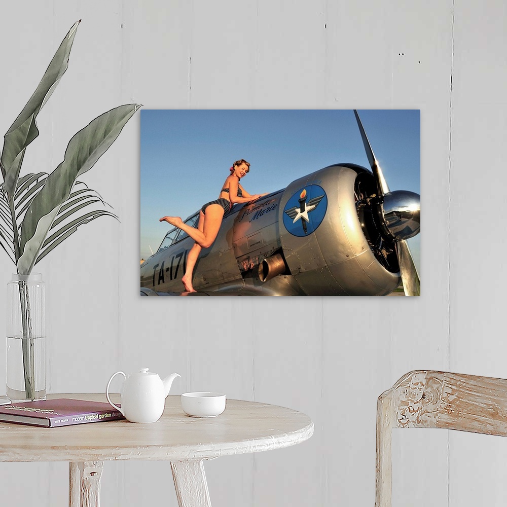 A farmhouse room featuring 1940's style pin-up girl standing on the wing of a World War II T-6 Texan.