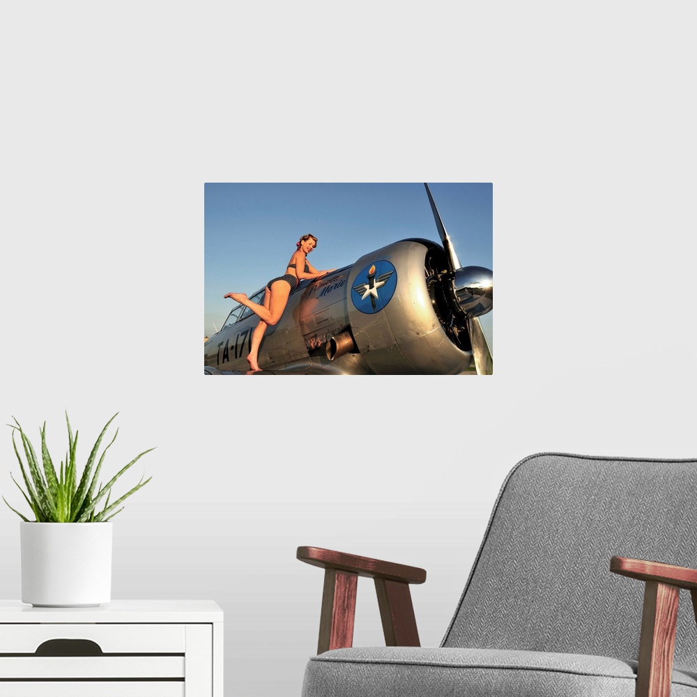 A modern room featuring 1940's style pin-up girl standing on the wing of a World War II T-6 Texan.