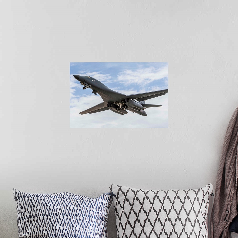 A bohemian room featuring A B-1B Lancer of the U.S. Air Force taking off.