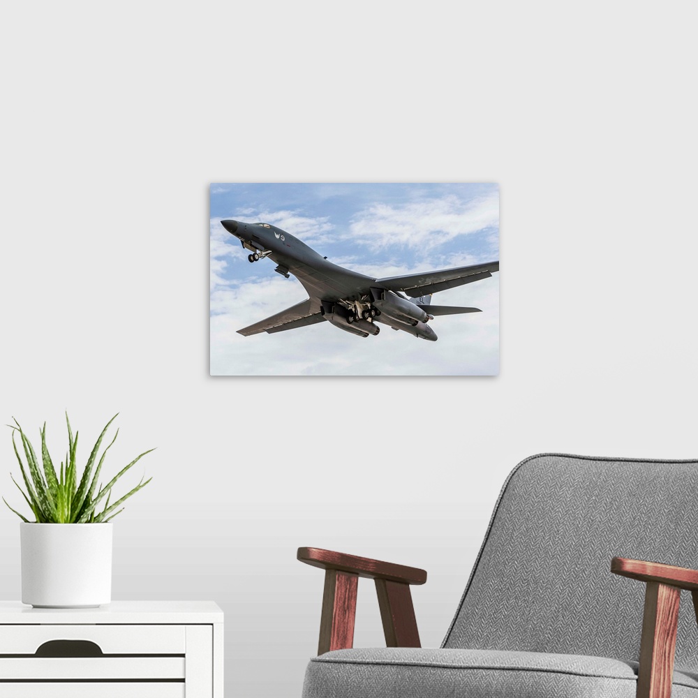 A modern room featuring A B-1B Lancer of the U.S. Air Force taking off.